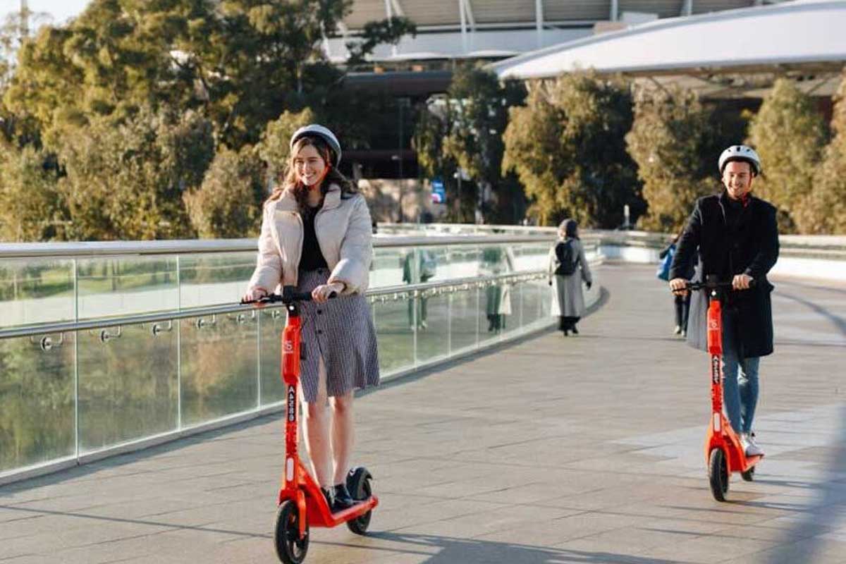people riding e-scooters